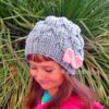 knitted grey hat with knit pink bow on side