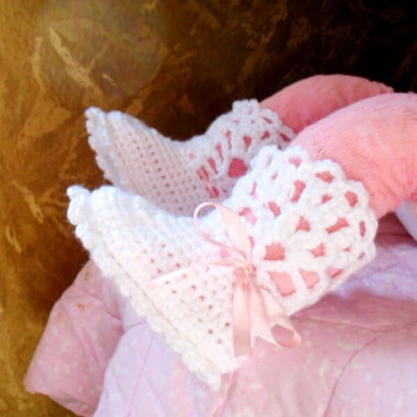 White Crocheted Baby booties with lace top and pink ribbon