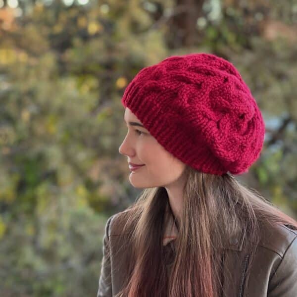 Red cabled slouchy hat shown side