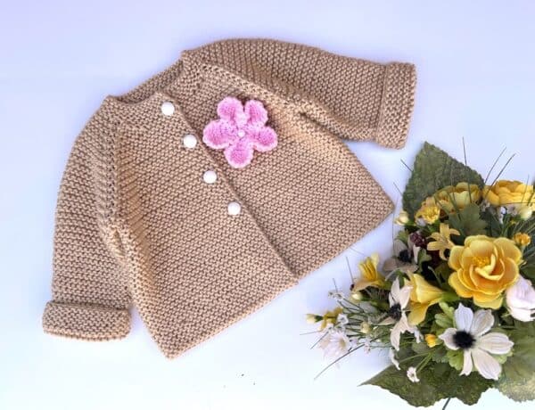Beige baby cardigan with pink flower